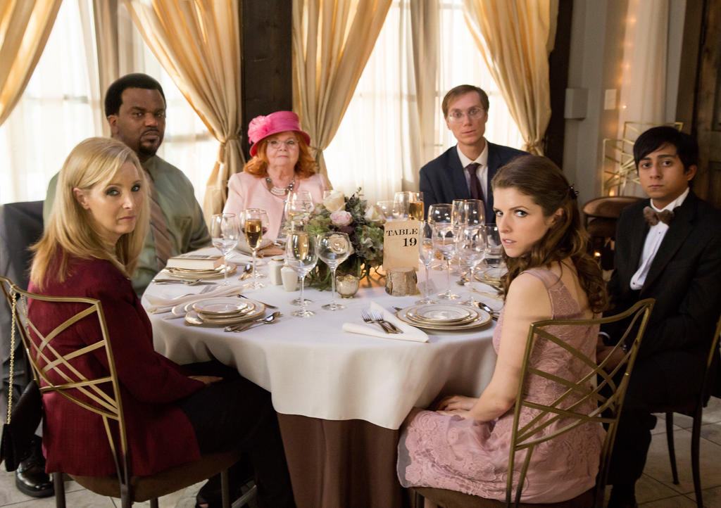 The guests at table 19 - Bina (Lisa Kudrow) and Jerry Kepp (Craig Robinson), Jo Flanagan (June Squibb), Walter Thimble (Stephen Merchant), Renzo Eckberg (Tony Revolori) and Eloise McGarry (Anna Kendrick). 