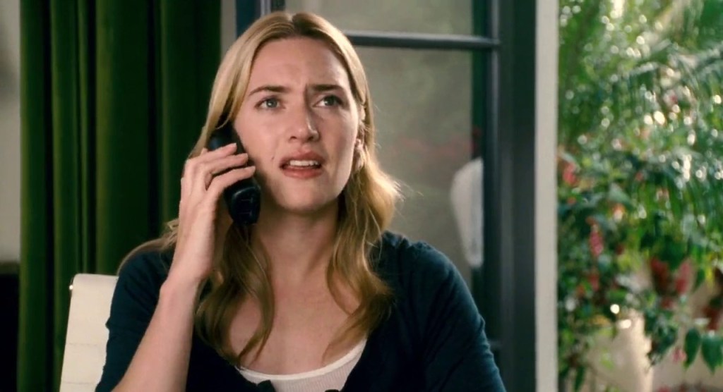 Iris (Kate Winslet) on the phone.