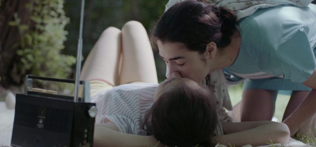 Teenaged Nana (Mariam Iremashvili) kissing Irina (Nina Mazodier).