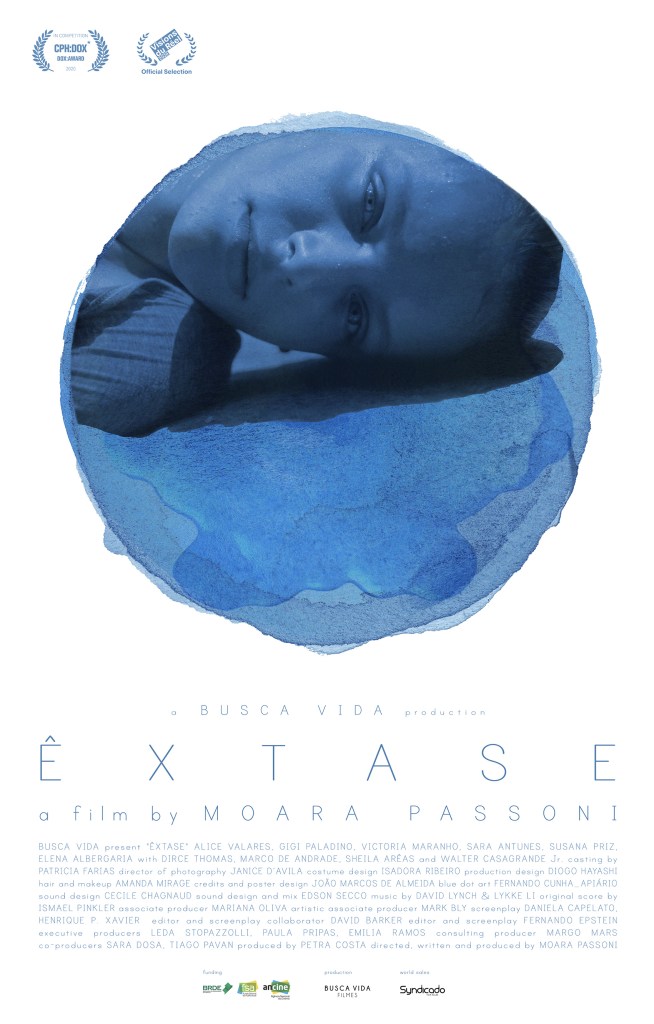 The film poster showing a young woman (Victoria Maranho) laying sideways on the floor. Only her head can be seen in a circular blue cutout over a white background.