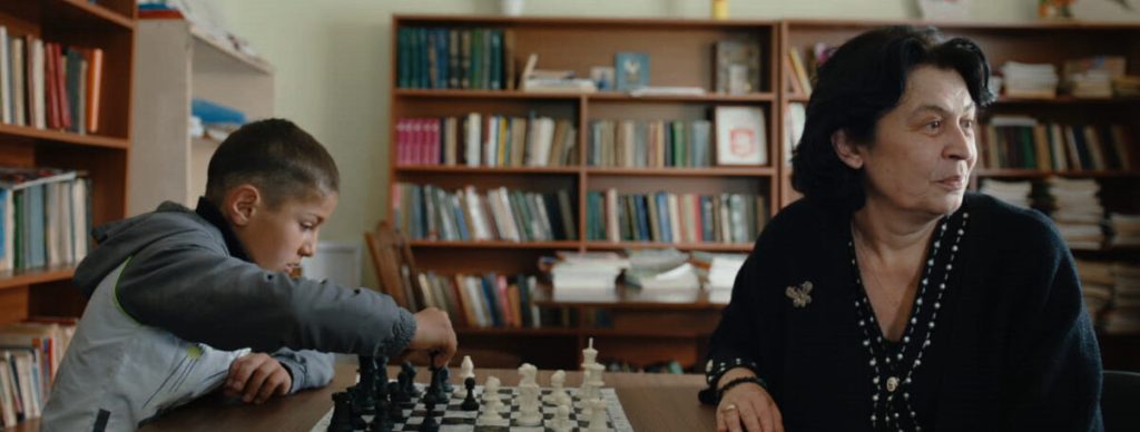 Nana Ioseliani playing chess with a kid.