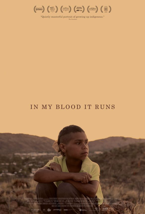 The film poster showing Dujuan crouching in the desert.