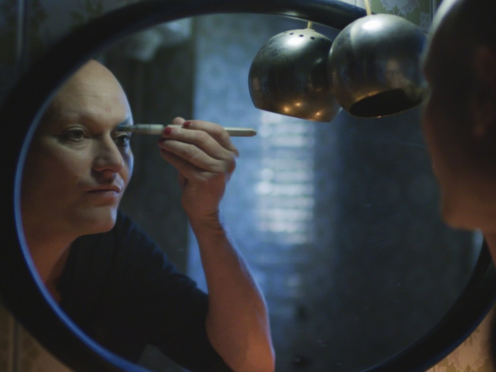 Bianca putting on her make-up.