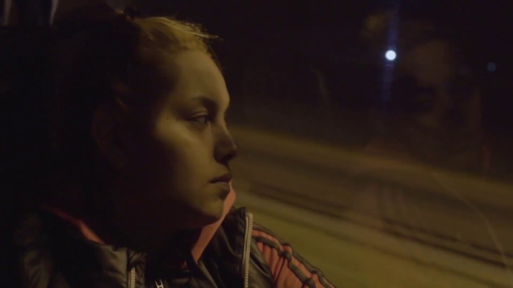 Barbara (Barbara Elisabeth Stanganelli) taking the bus at night.