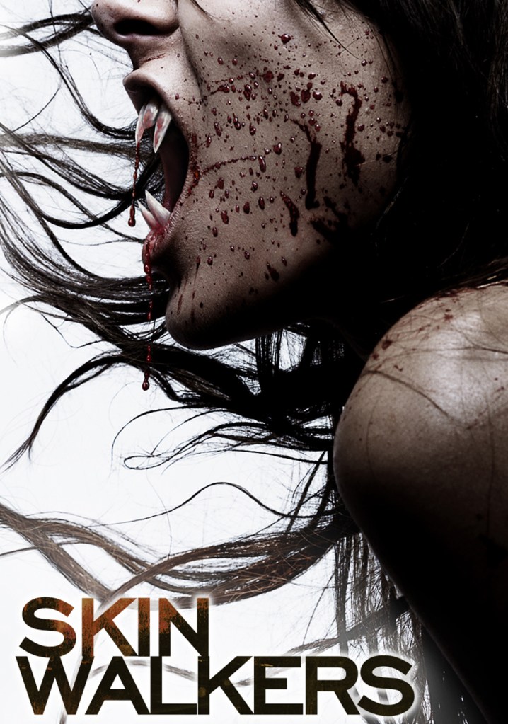 The film poster showing a woman's mouth filled with sharp teeth, her face is splattered with blood.