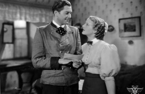 Josef Rainer (Carl Esmond) and Leni Schindler (Hortense Raky) talking.