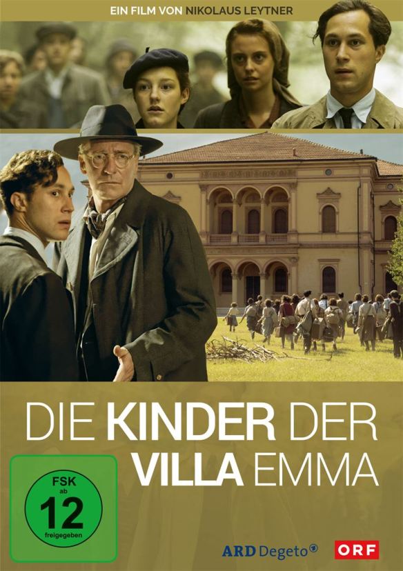 The film poster showing a group of children running towards a big mansion as well as several characters from the film.