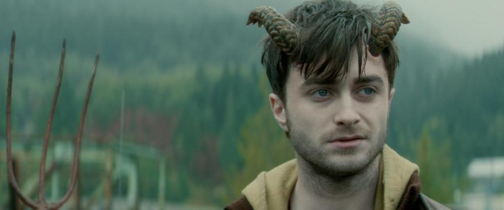 Ig (Daniel Radcliffe) standing next to a pitchfork.