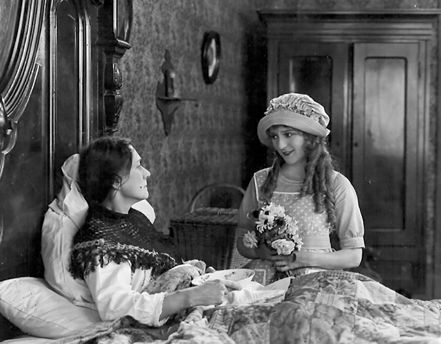 Pollyanna (Mary Pickford) visiting a sick woman.