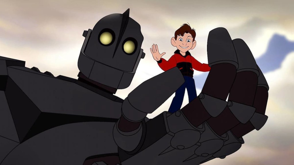 The Iron Giant giving Hogarth a ride in his hand.