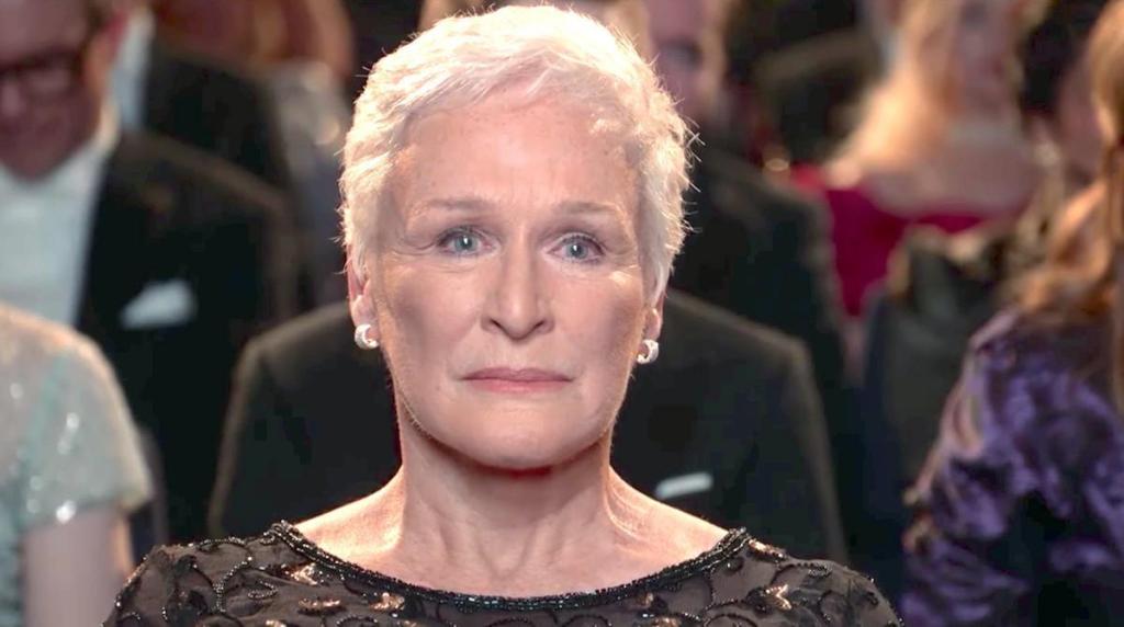 Joan (Glenn Close) sitting in the audience of the awards ceremony.