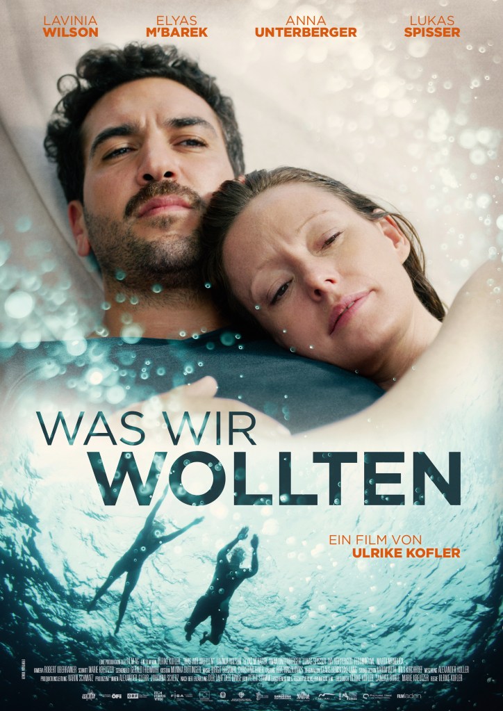 The film poster showing Alice (Lavinia Wilson) and Niklas (Elyas M'Barek) cuddled together and swimming in the sea.