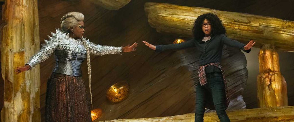 Meg (Storm Reid) reaching for Mrs Which (Oprah Winfrey) as she tries to balance on a stone.