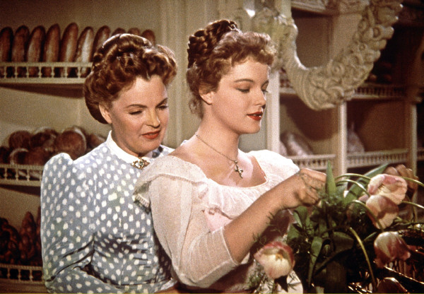 Stanzi (Romy Schneider) arranging some flowers while talking to her aunt Therese (Magda Schneider). 