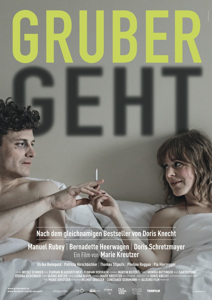 The film poster showing Gruber (Manuel Rubey) in bed with Sarah (Bernadette Heerwagen). She is handing him a cigarette.