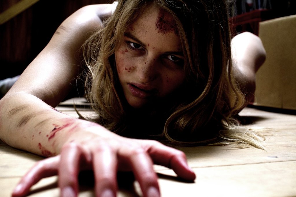 Sam (Sarah Jeavons) dragging herself over the floor.