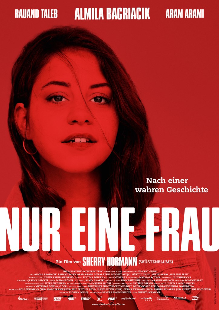 The film poster showing Aynur (Almila Bagriacik) in red and black.