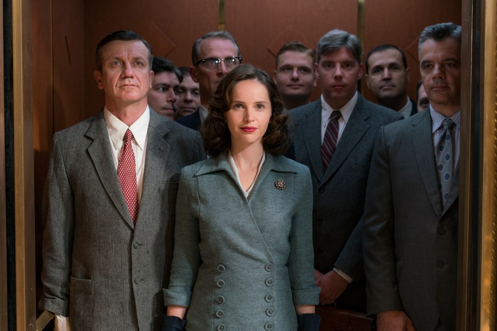 Ruth Bader Ginsburg (Felictiy Jones) getting into an elevator with only men. 