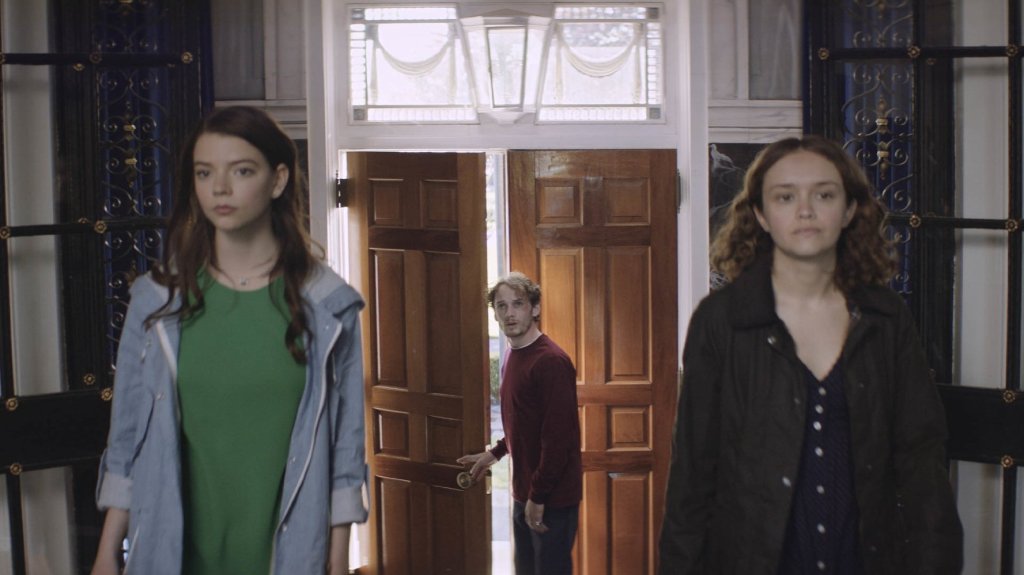 Lily (Anya Taylor-Joy) and Amanda (Olivia Cooke) showing Tim (Anton Yelchin) into Lily's house.
