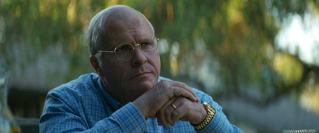 Dick Cheney (Christian Bale) with stapled hands and a worried face.
