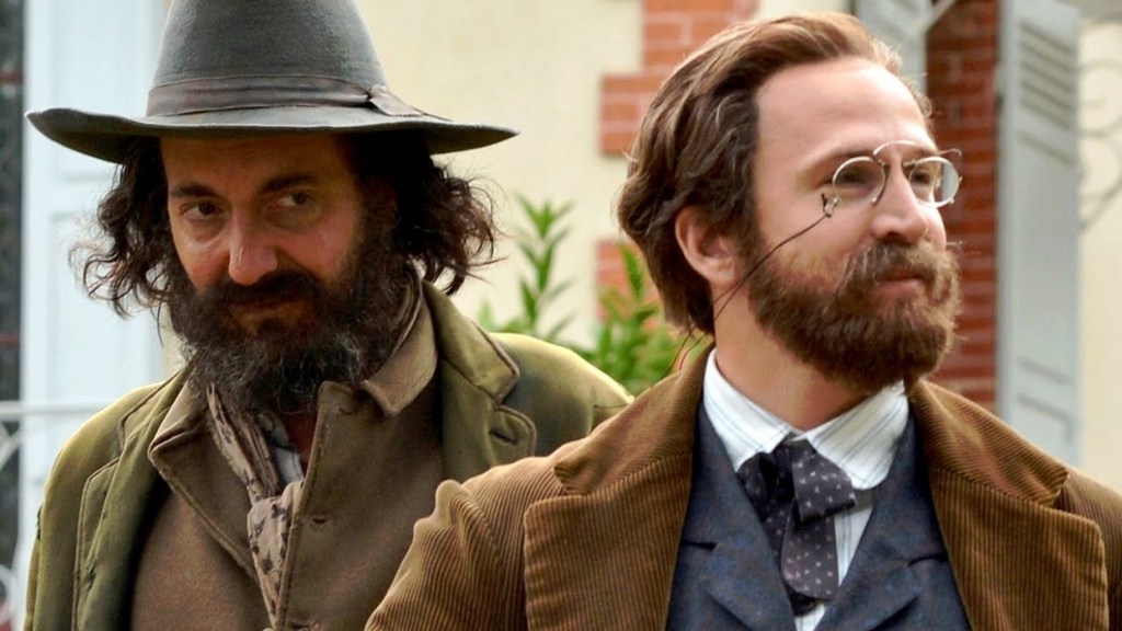 Paul Cézanne (Guillaume Gallienne) and Émile Zola (Guillaume Canet) standing next to each other.