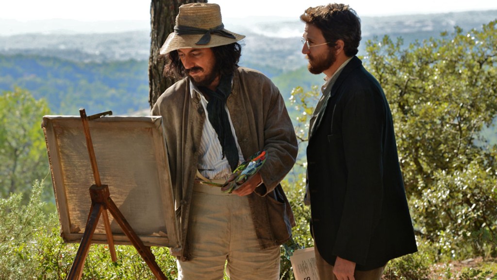 Émile Zola (Guillaume Canet) talking Paul Cézanne (Guillaume Gallienne) as the latter paints.