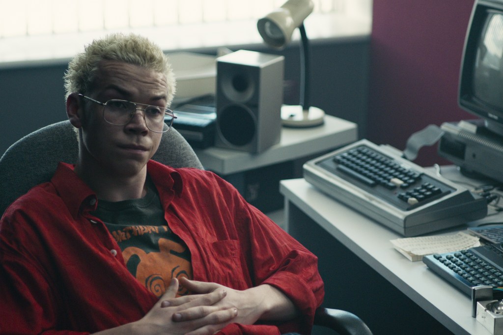 Colin (Will Poulter) at his workstation.
