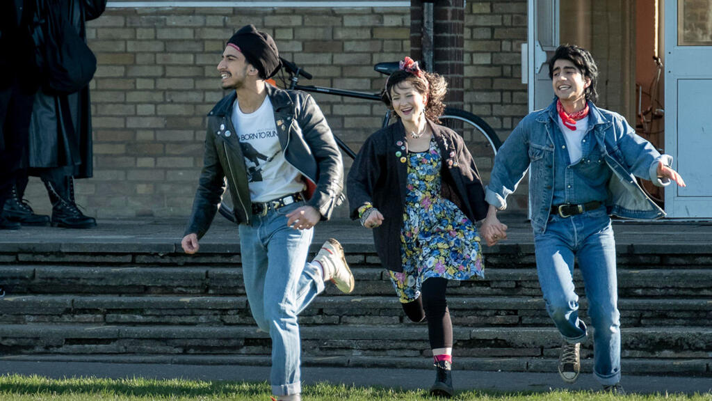 Roops (Aaron Phagura), Eliza (Nell Williams) and Javed (Viveik Kalra) running from their school building. 