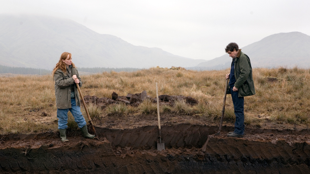 Anne (Lotte Verbeek) and Martin (Stephen Rea) working together in the moors.