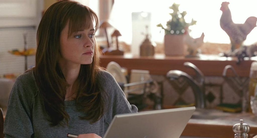 Ryden (Alexis Bledel) writing applications.