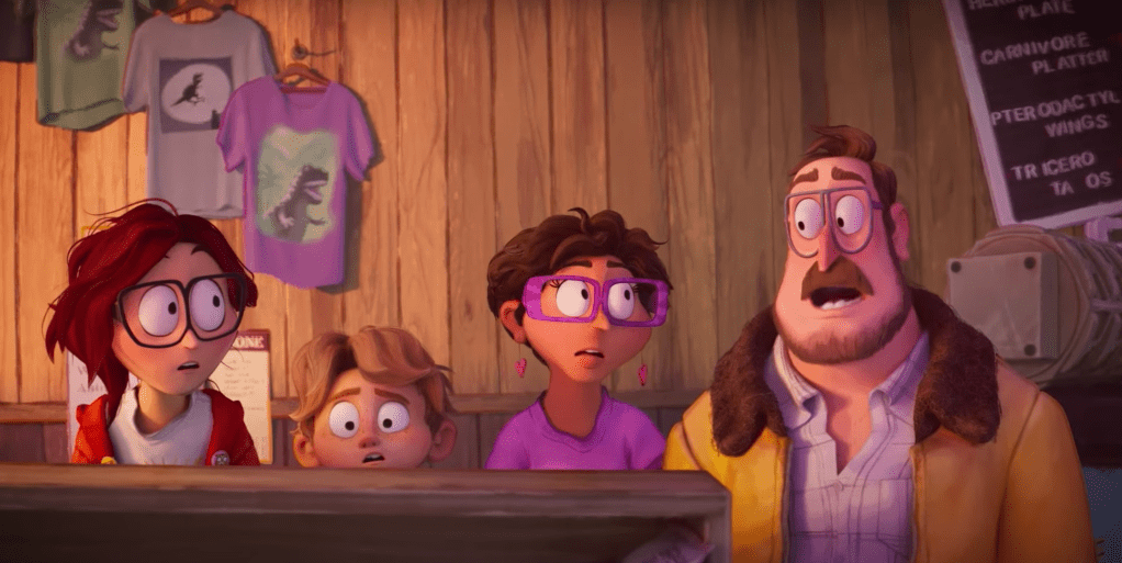 The Mitchell family hiding in a souvenir shop, looking at each other with big eyes.