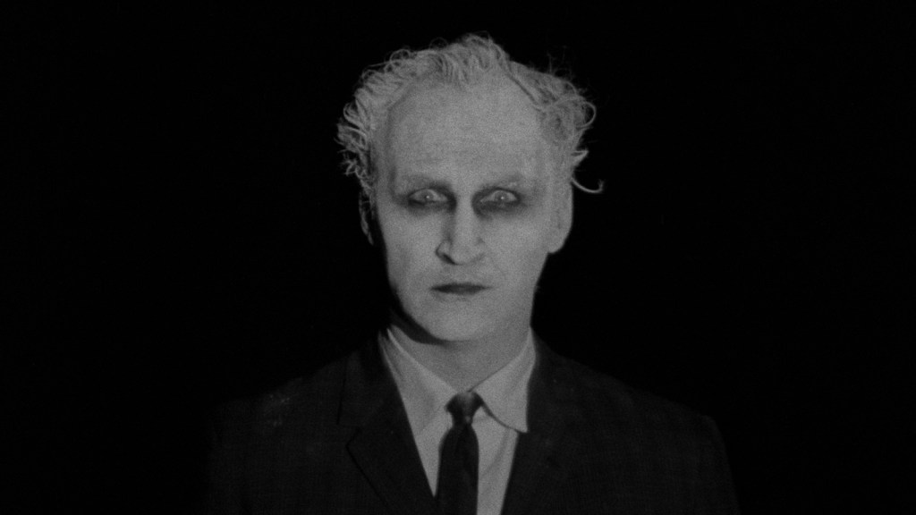 The Man (Herk Harvey) who keeps following Mary.