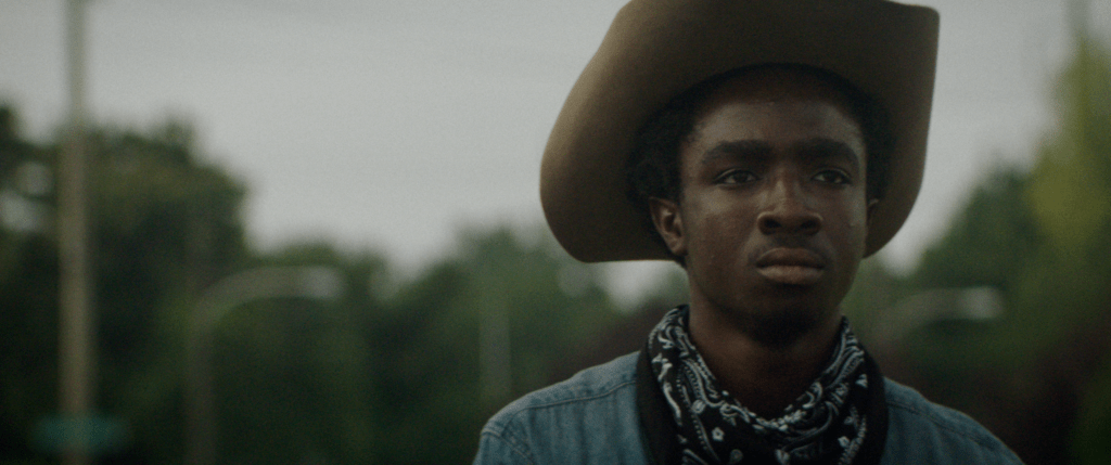 Cole (Caleb McLaughlin) wearing a cowboy hat.