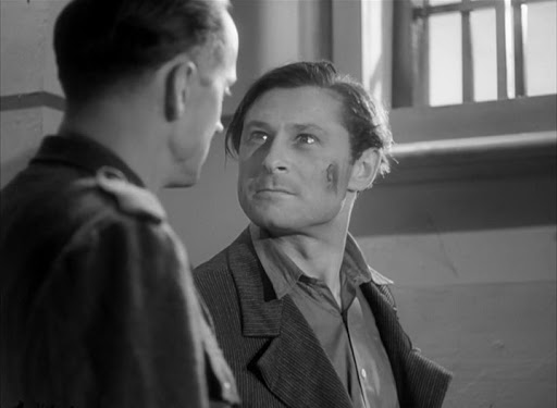 Michael (Poul Reichhardt) being interrogated.