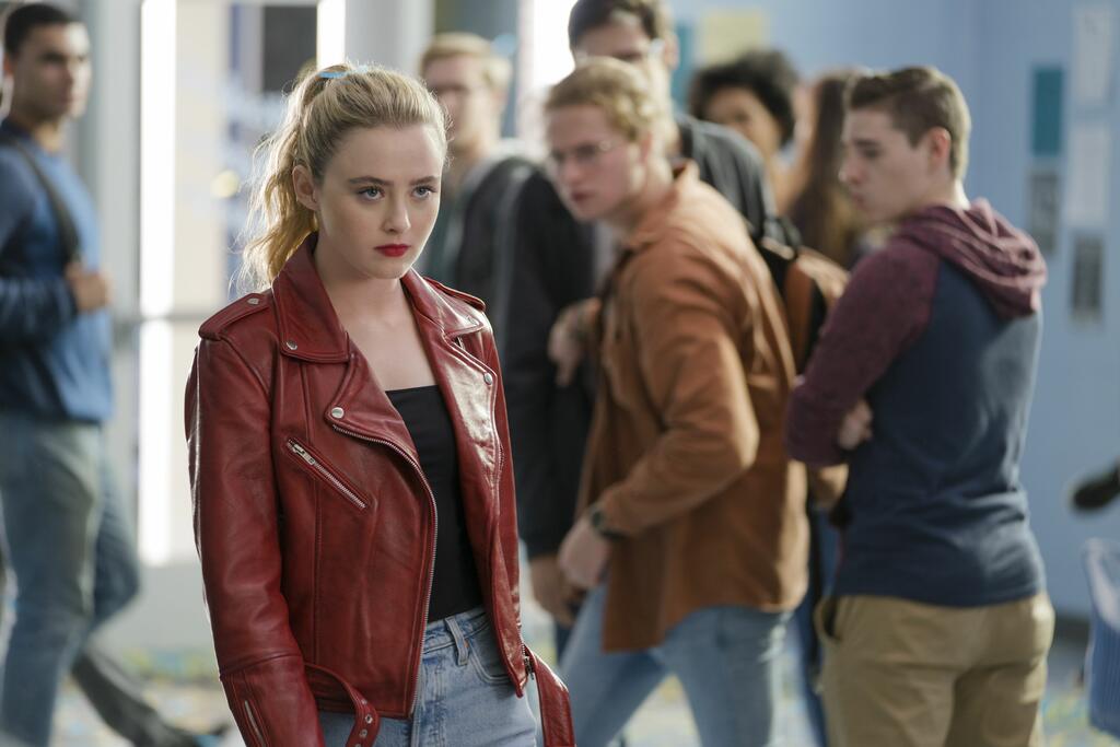 The Butchter in Millie's body (Kathryn Newton) striding confidently through school.
