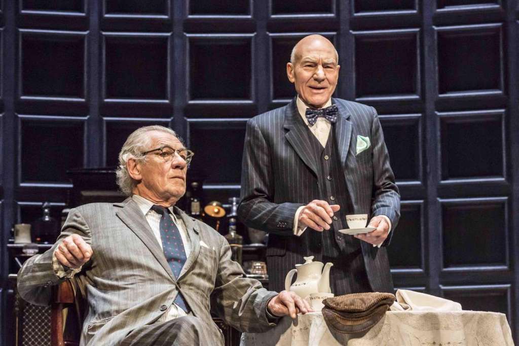 Spooner (Ian McKellen) and Hirst (Patrick Stewart) having tea together.