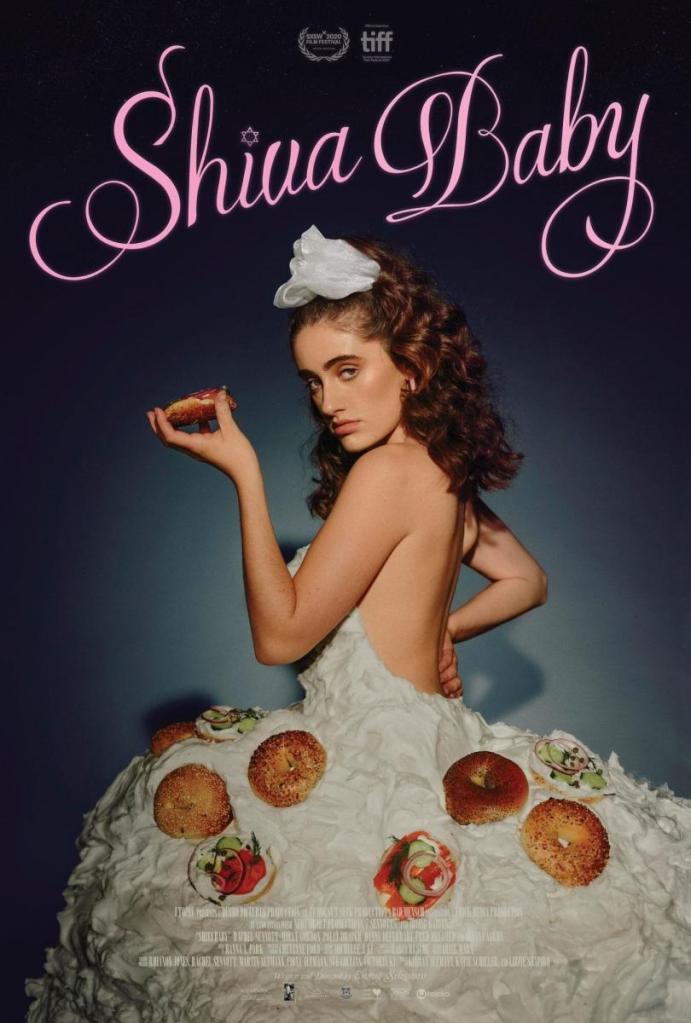 The film poster showing Danielle (Rachel Sennott)in a dress made of cream cheese and bagels, holding up a bagel.