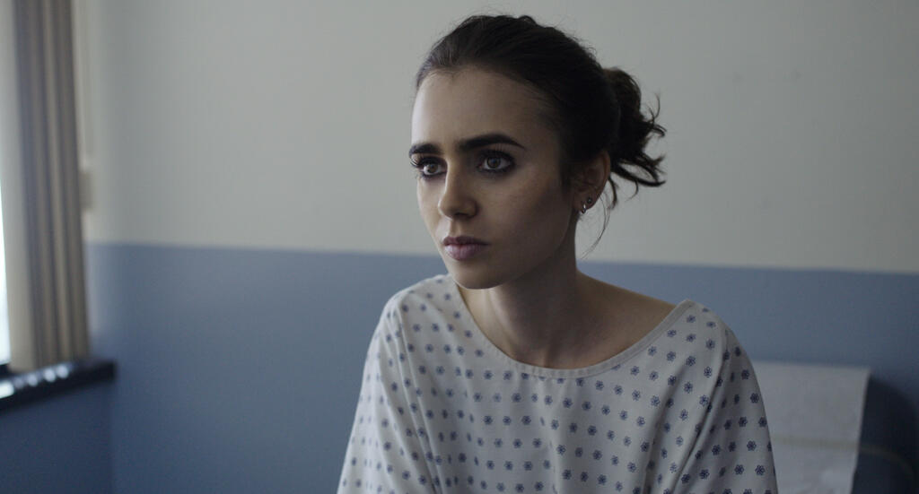 Ellen (Lily Collins) at the doctor's office.