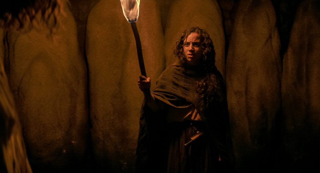 Deena as Sarah Fier (Kiana Madeira) holding up a torch.