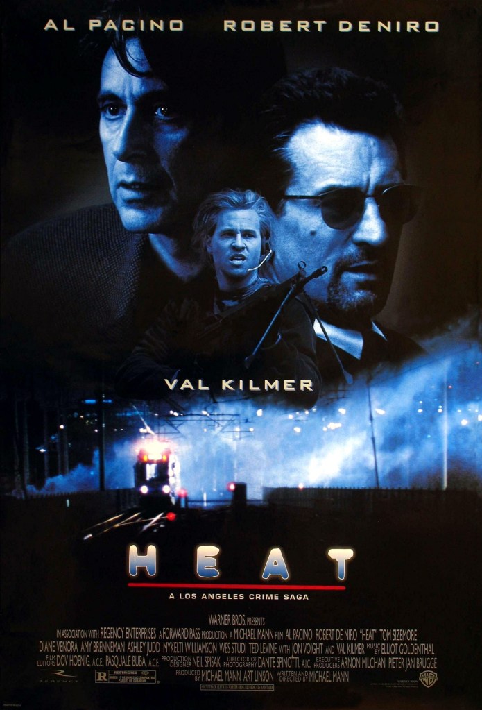 The film poster showing Vincent (Al Pacino), Neil (Robert De Niro) and Chris (Val Kilmer) in black and blue, above an image of a train at night.