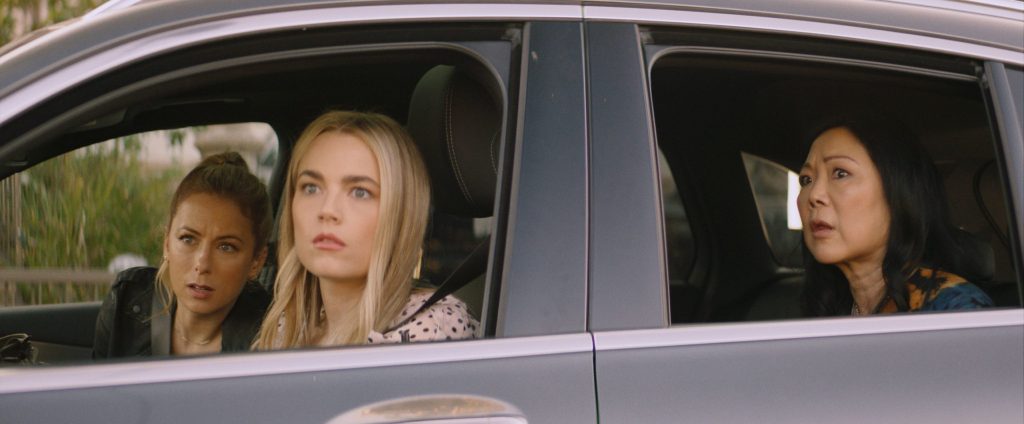 Andrea (Iliza Shlesinger), Serrena (Rebecca Rittenhouse) and Margot (Margaret Cho) in a car, staking something out.