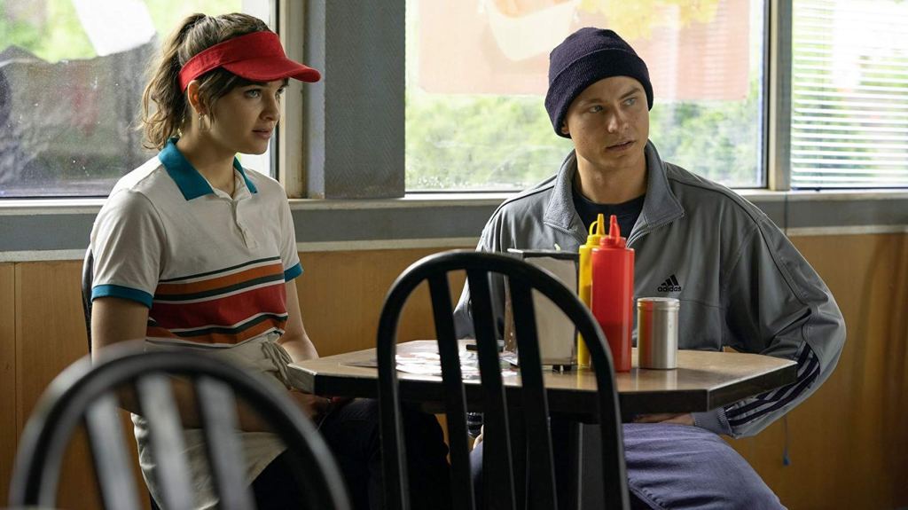 Isi (Lisa Vicari) and Ossi (Dennis Mojen) in the fast food restaurant where Isi finds a job. 