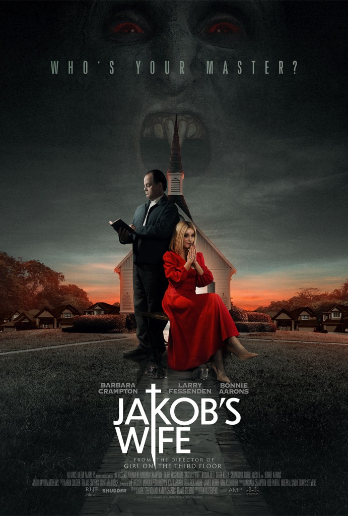 The film poster showing Jakob (Larry Fessenden) reading in a bible and Anne (Barbara Crampton) praying next to him in a startling red dress. Behind them is a chruch, and in the sky we can see a half-transparent face of a vampire.