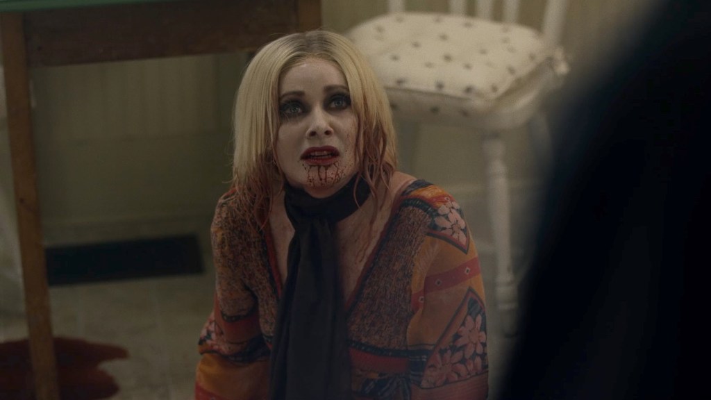 Anne (Barbara Crampton) with her chin full of blood.