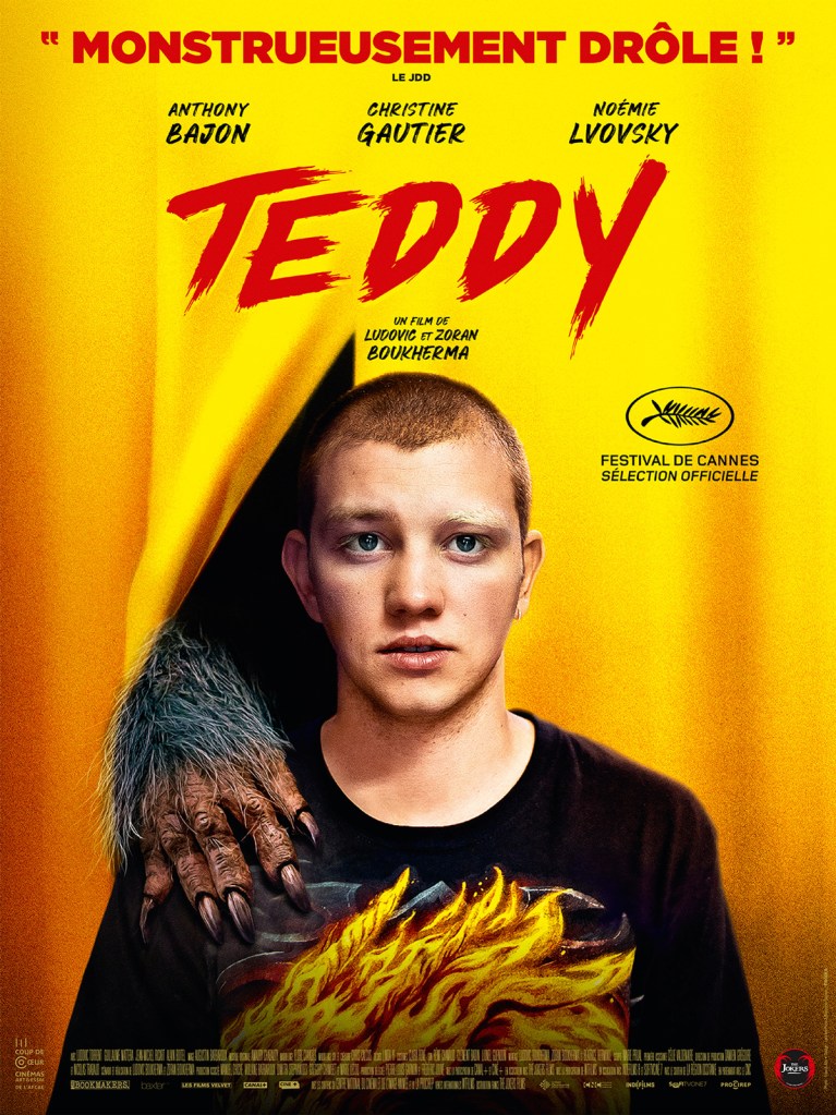 The film poster showing Teddy (Anthony Bajon) standing in front of a yellow curtain. There is a werewolf paw pushing through the curtain and laying on his shoulder.