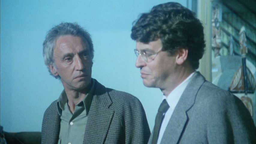 Bernard (Arthur Dignam) talking to his boss at the museum, Dr Richards (John Noble). 
