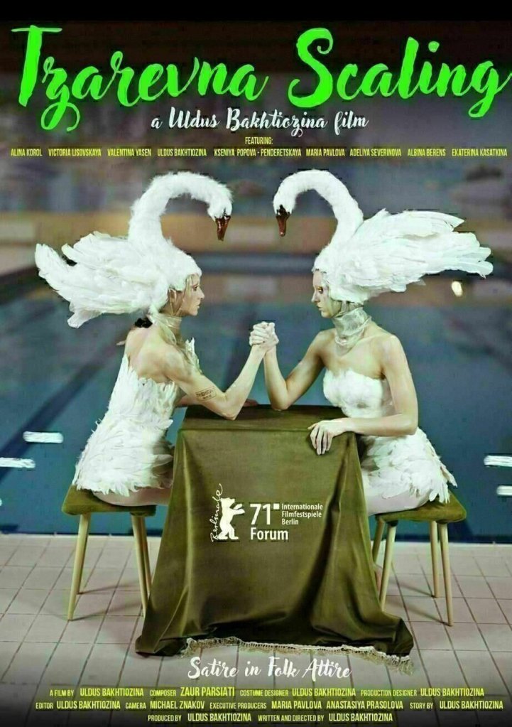 The film poster showing two women wearing elaborate swan hats sitting at a table next to a swimming pool where they armwrestle.