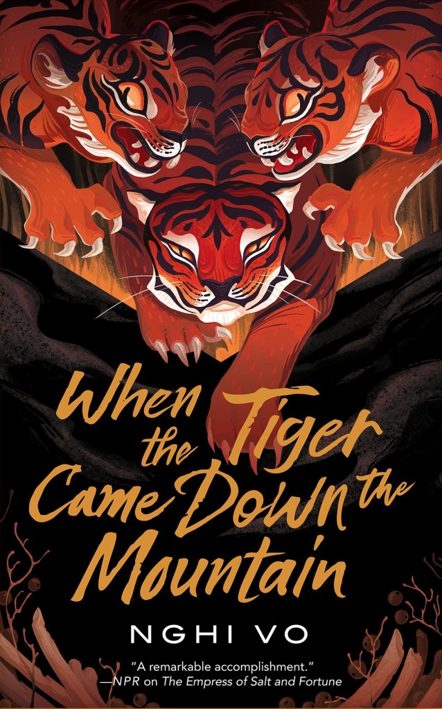 The book cover showing three painted tigers walking down towards a hill or mountain.