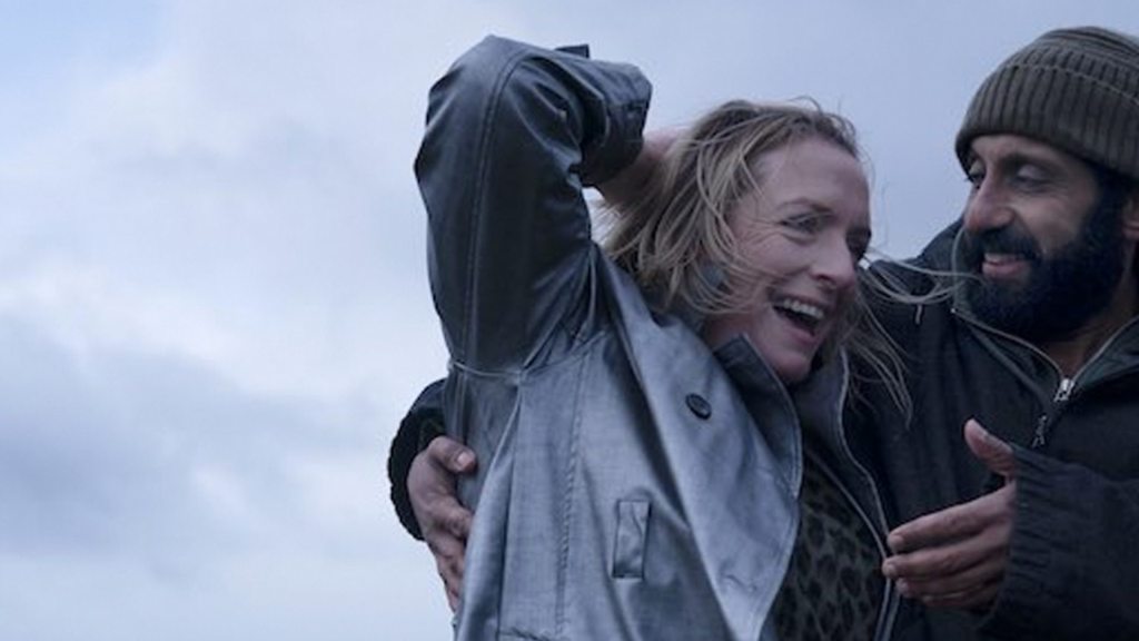 Ali (Adeel Akhtar) eith his arm around Ava (Claire Rushbrook) as they walk.