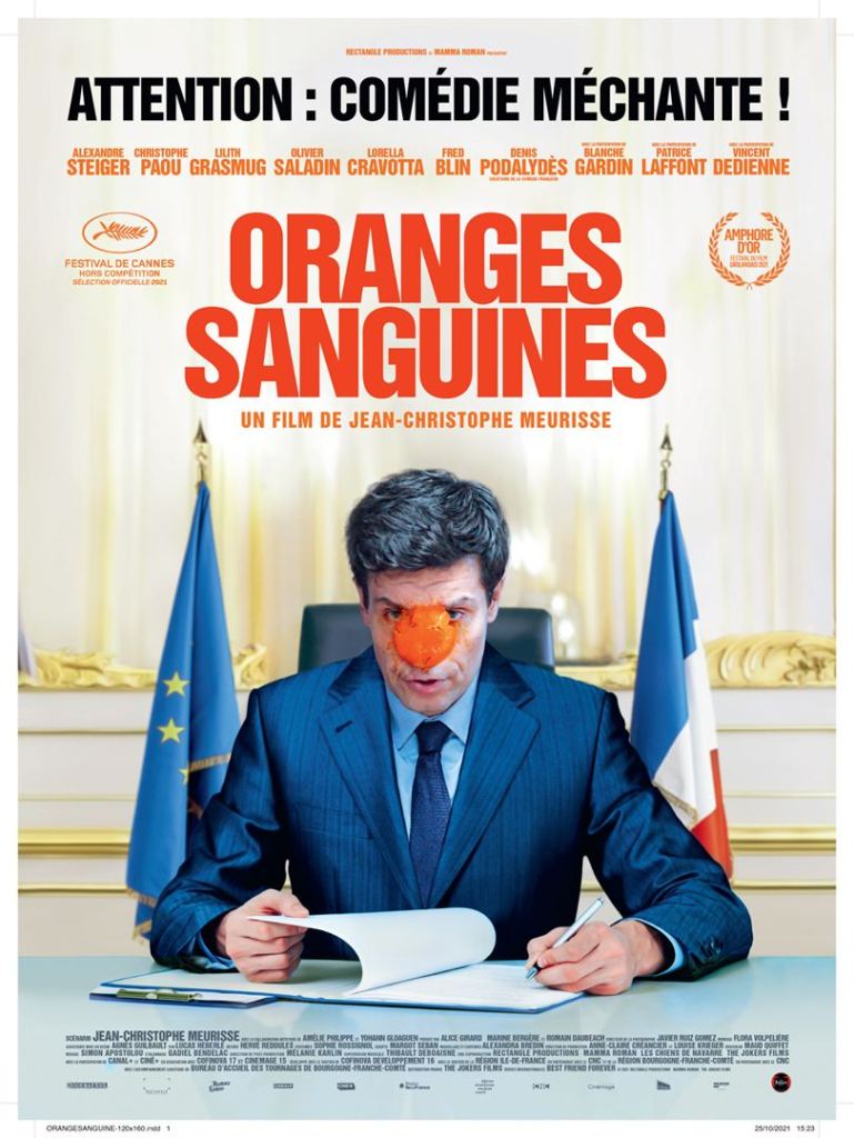 The film poster showing a politician with an orange in his face as if it was a clown's nose.